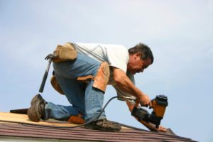 Roofing Contractor working on a roof